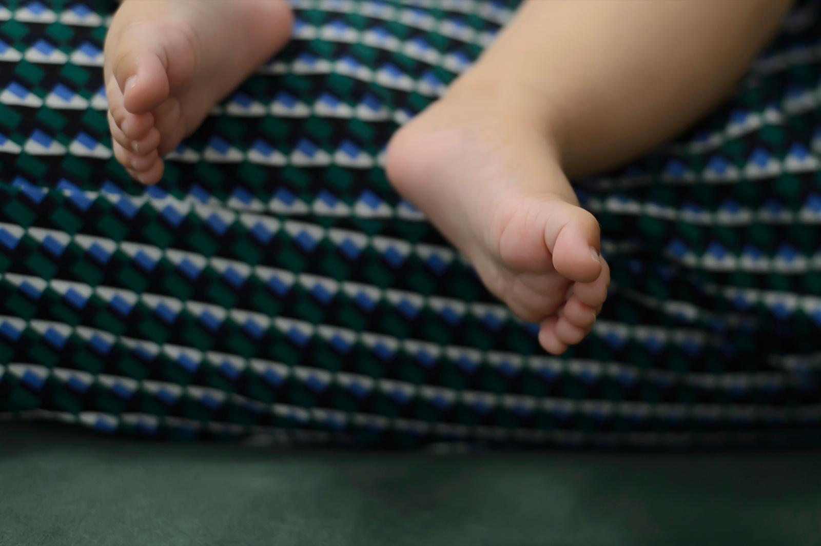 Baby feet wearing striped socks